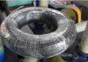 spool of cable packed by stretch wrap